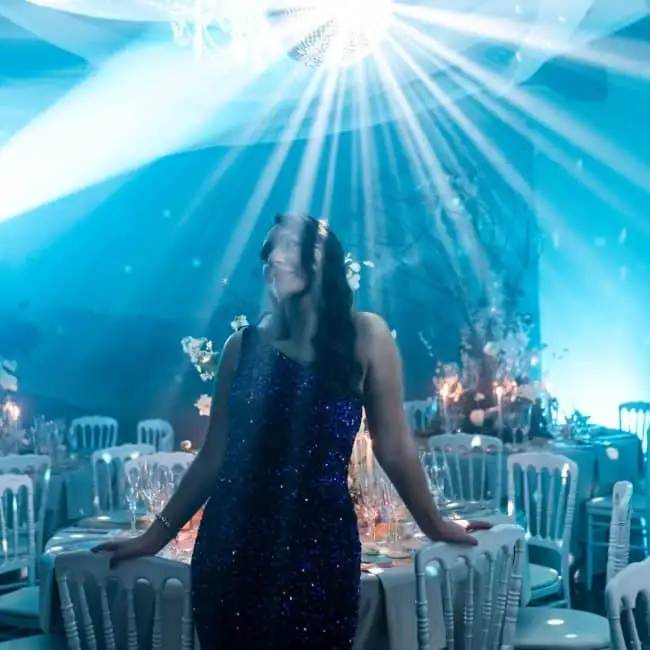 Elegant wedding planner ChiaraB Events during a wedding party, ambience with soft lighting and floral decorations, perfect for luxury events and dream weddings.
