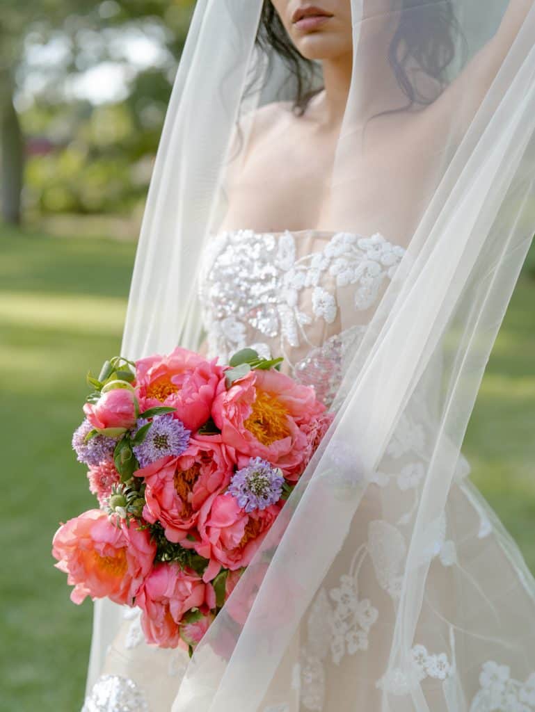 Colorful bridal flowers with peony and lilac bouquets, in an outdoor garden, perfect for elegant and romantic weddings.