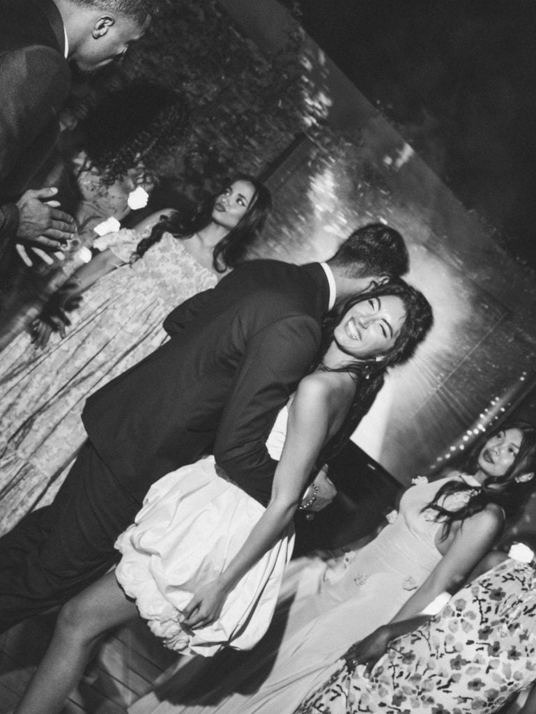 Elegant couple dancing during the wedding reception, with romantic and festive atmosphere, perfect for wedding planning and event organization services.